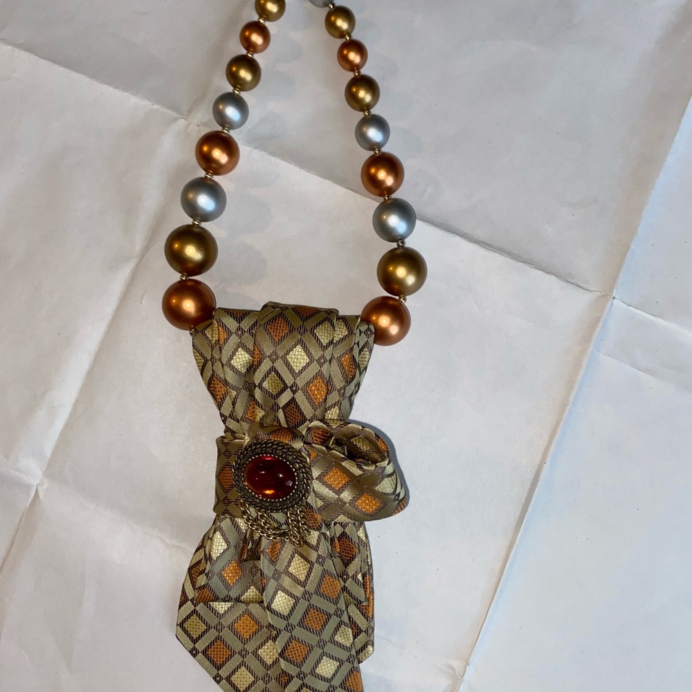 Elegant Gold & Bronze Bead Necklace with Patterned Bow Accent